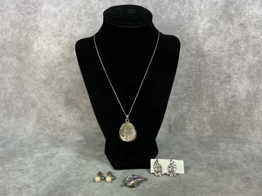 Sterling silver abalone pendant on a sterling chain, abalone set in sterling brooch, and two pairs