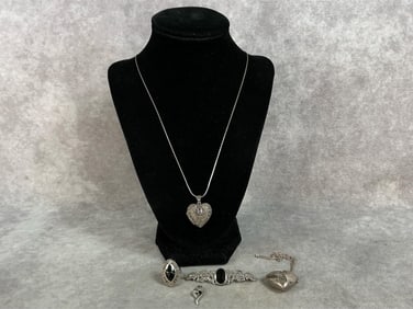 Two sterling lockets on sterling chains, matching brooch and size 5 ring with faux onyx stones, and