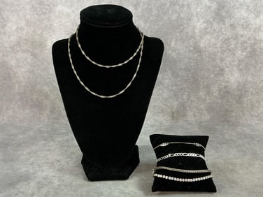 Four sterling silver bracelets, and one sterling silver chain. All marked 925. Total weight 0.96