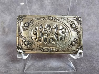 Victorian repousse silver snuff box with dancing cherub design. Marked 830 silver on bottom. Total