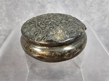Victorian sterling silver pill or trinket box with floral repousse hinged lid. Made by A. Jacobi and
