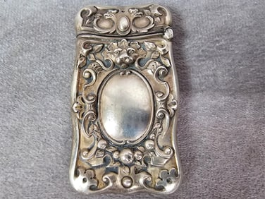 Circa 1900 sterling silver match safe possibly made by Gorham with lion and eagle head design.
