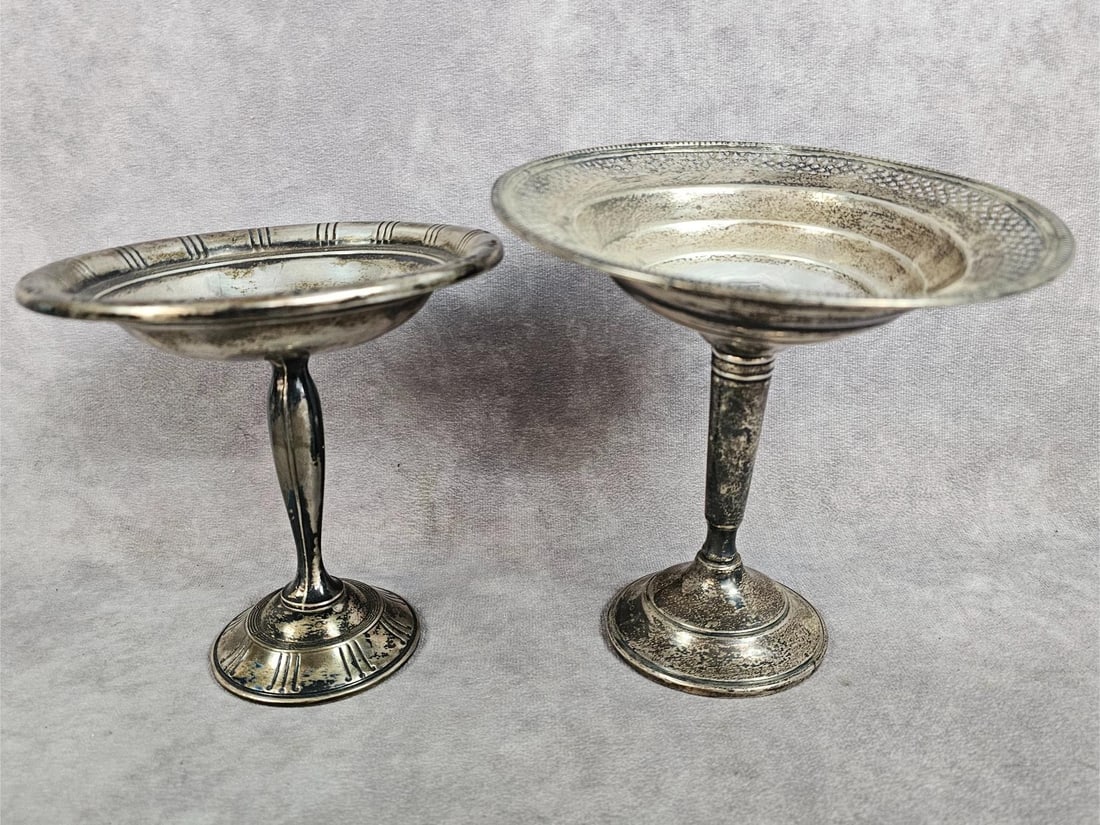 Two weighted sterling silver compotes or nut dishes. Smaller one marked weighted sterling, other: Two weighted sterling silver compotes or nut dishes. Smaller one marked weighted sterling, other says sterling cement reinforced with steel rod. Total weight for both is 12.76 ozt.