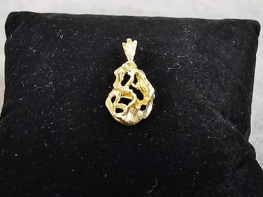 Unmarked 14kt gold pendant. Tested and verified 14kt. Total weight 0.7 dwt.