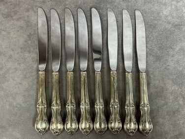 Eight Sterling handle butter knives, marked on side of each handle. Total weight 1.32 lbs.