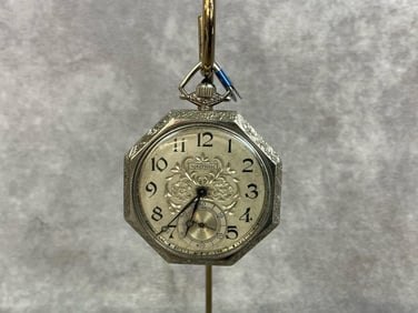 1920s 14kt white gold octagonal pocket watch made by Waltham. Blue jeweled stem, seconds subdial,
