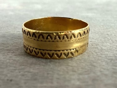 14k gold band. Size 9, weighs 3.8 grams. Stamped 14k on inside.