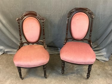 Late 19th century lot of two Victorian carved and upholstered walnut side chairs with front leg