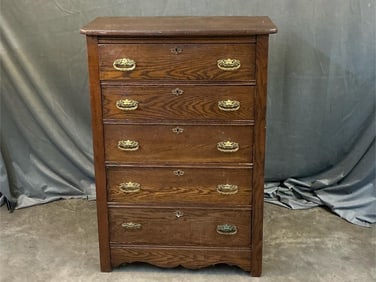 Early 20th century oak chest of seven drawers. Brass pulls. Missing top mirror. Bracket base. Old