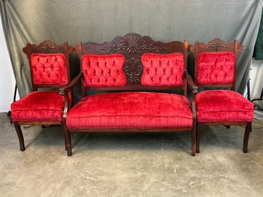 Late 19th - early 20th century red velvet settee/love seat with pair of matching side chairs. Carved