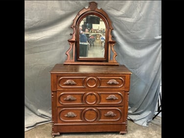 Late 19th century Victorian walnut carved three drawer dresser with mirror. Retains original wooden