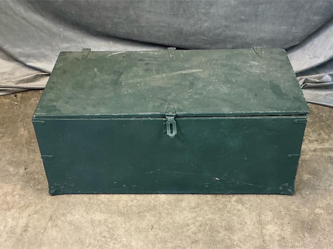 Circa 1950's repainted wooden dark green foot locker. Good condition. Measures 32 inches length x: Circa 1950's repainted wooden dark green foot locker. Good condition. Measures 32 inches length x 16.25 x 13 inches tall.