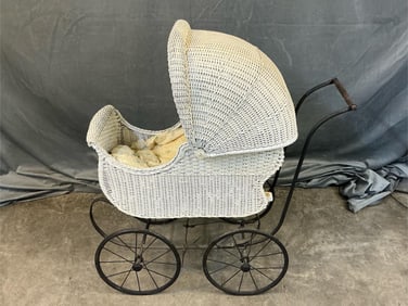 Early 20th century white wicker baby carriage with storage area inside carriage and adjustable back