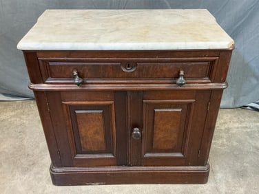 Circa 1870 Victorian carved walnut marble top washstand. Pine secondary wood. Original hardware.