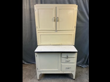 1930's Sellers brand Hoosier cabinet with porcelain top. Flour bin missing, loose handles, warpage