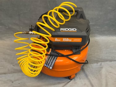6 Gallon 150 PSI. Orange/Black. With Coil Hose and Air Chuck. Additional 50 ft Hose with Air Chuck.