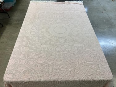 Vintage light pink and white chenille bedspread with fringe on three sides. A couple light stains