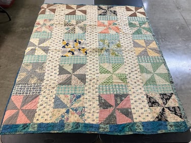 Vintage pinwheel pattern quilt, hand stitched, with Batik fabric backing. Good condition. Measures