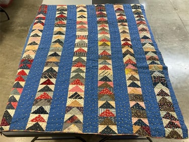 Vintage flying geese pattern quilt. Machine stitched and hand tied. Some fading and couple small