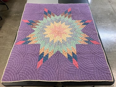 Vintage hand stitched lone star pattern quilt made from feedsack material. Some fading to colors but