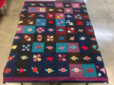 Vintage 3D applique patchwork quilt, hand stitched, with applied birds, flowers, and butterflies.