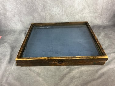 Mid 20th century pine display case. Blue cloth lining. Wear to wood and plastic top. Measures 23