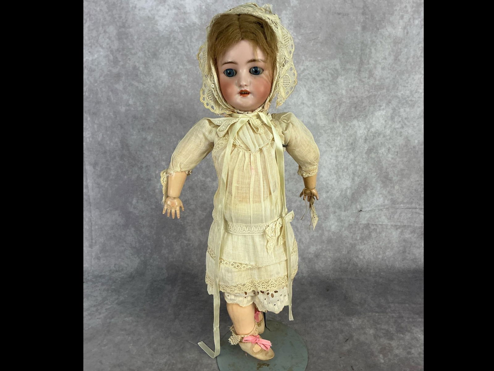 Early 20th century Simon Halbig Bisque head doll with C.M. Bergman body. Original clothing. Some: Early 20th century Simon Halbig Bisque head doll with C.M. Bergman body. Original clothing. Some discoloration to composite body otherwise good condition. Measures 10 inches wide x 4.5 x 20 inches tal