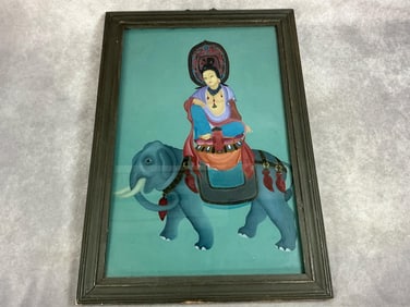 Mid 1900s painting. Wood framed painting of Buddhist deity riding an elephant, similar to a Thangka.