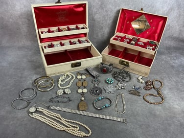 Fifty pieces of mid century to modern jewelry. Includes brands like Trifari, Brooks, Coro, Weiss and