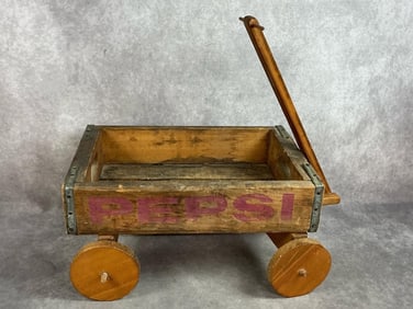 Mid 1900s Pepsi crate wagon. Homemade wooden child's wagon made from vintage Pepsi Cola crate. In