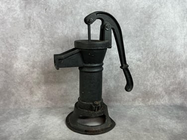 Early 1900s pump. Hand operated cistern pump made of cast iron. Good condition. Measures 7 inches