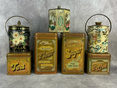 Group of seven 1960's - 1970's tin food storage containers. Two large sugar and flour containers