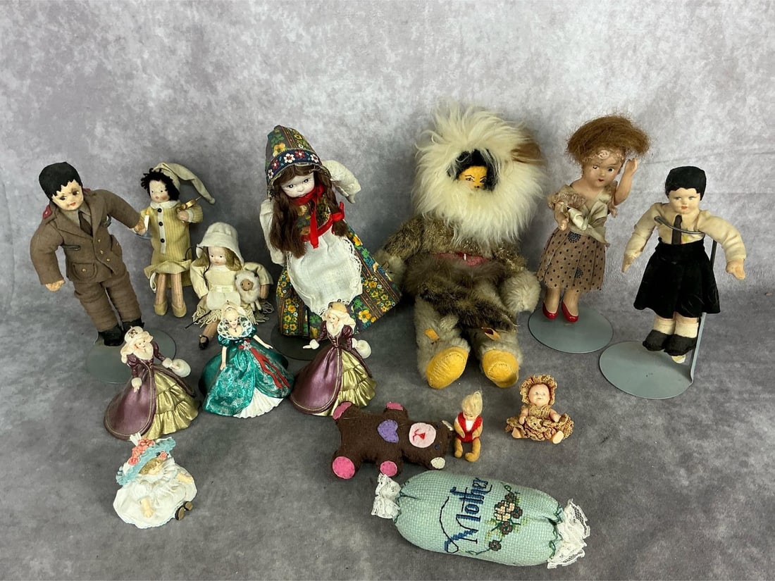 Early - mid 20th century small Dolls. Fourteen total pieces. Handmade Eskimo doll with rabbit fur: Early - mid 20th century small Dolls. Fourteen total pieces. Handmade Eskimo doll with rabbit fur coat and seal made with seal fur on lap. One composite doll, one bisque doll, three holiday Barbie Dol