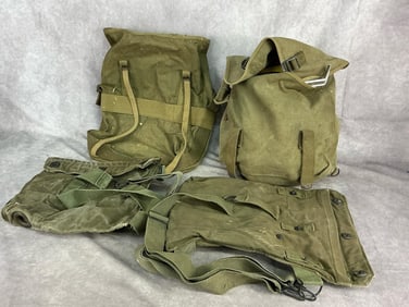 Two Mid 20th century military rucksacks one with various camping tools including sterno, two mess