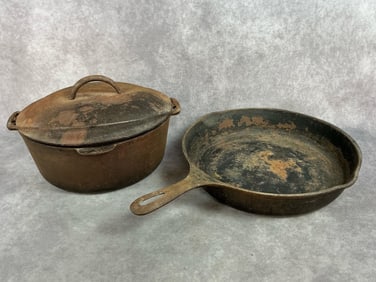 Two early 1900s cast iron pieces. Number 8 Griswold Dutch oven with lid and handle and number 10