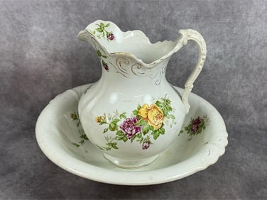 Early 1900s basin and pitcher. Cairo porcelain with floral pattern and gold trim. Some marks and