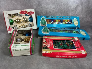 Five boxes of mid century lights and ornaments. Two Tumi indoor light sets and a weatherproof light