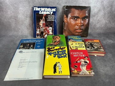 Nine vintage books. Hardback books include The Wildcat Legacy, Muhammad Ali, Cosell, and University