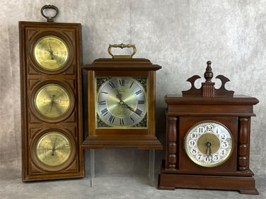 Two mantle clocks and a barometer. Larger wood topped clock tested and working. Linden clock