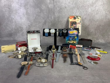 Mixed lot of watches for men and women including brands such as Guess, Geneva, Tommy Hilfiger, and