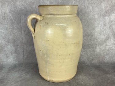 Late 1800s stoneware butter churn with applied handle and marked 4 on the side by the handle.