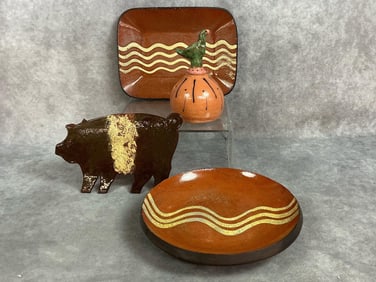 Four Turtlecreek and Sheldonville signed slipglaze pottery pieces. Oblong plate, small plate, pig by