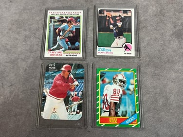 Four 1960s to 1980s cards. Two Pete Rose baseball cards, Hank Aaron Topps card, and Jerry Rice Topps