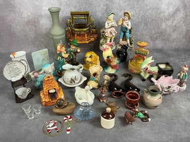 Thirty five vintage figures, includes McCoy wishing well, Avon Jasperware vase, and Homeco boy and