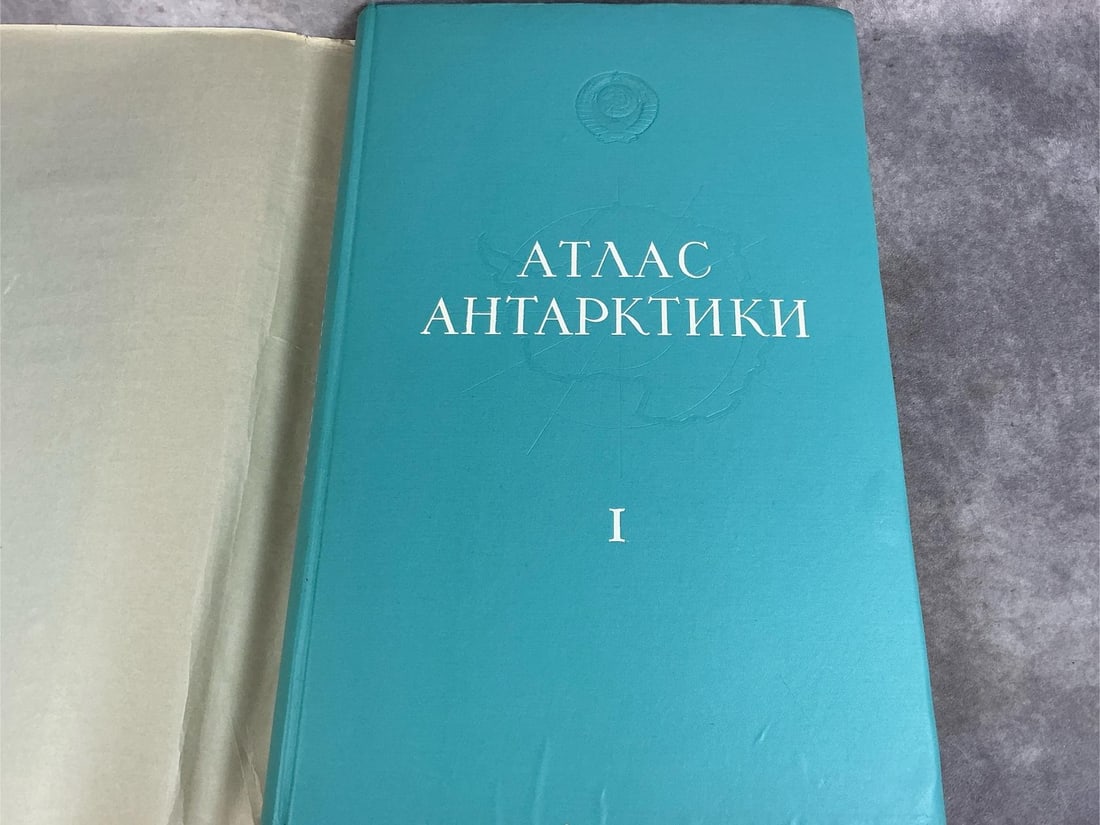 1966 atlas of Antarctica in Russian, in original dust jacket and box. Good condition. Measures 15.5: 1966 atlas of Antarctica in Russian, in original dust jacket and box. Good condition. Measures 15.5 inches wide x 2 x 23.75 inches tall.