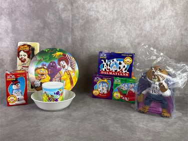 Lot of McDonalds finds including 101 Dalmatians ornaments, children's dish set, watch, and Beast.