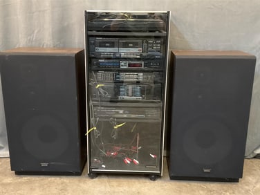 Vintage turntable, cassette player, tuner, compact disc player with power amplifier and stereo