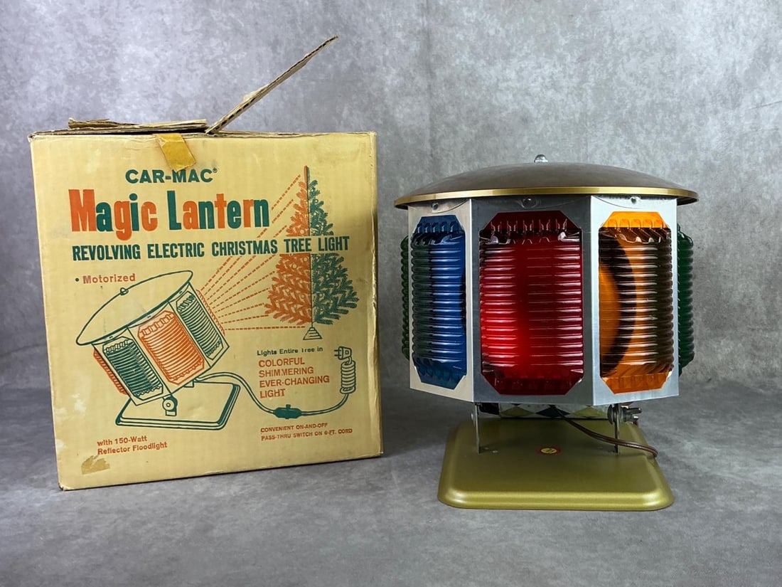 1960s Car-Mac Magic Lantern: 1960s Car Mac Magic Lantern revolving electric Christmas tree light in original box. Light features a revolving design with multicolor screens in red, orange, green and blue. In good condition with or