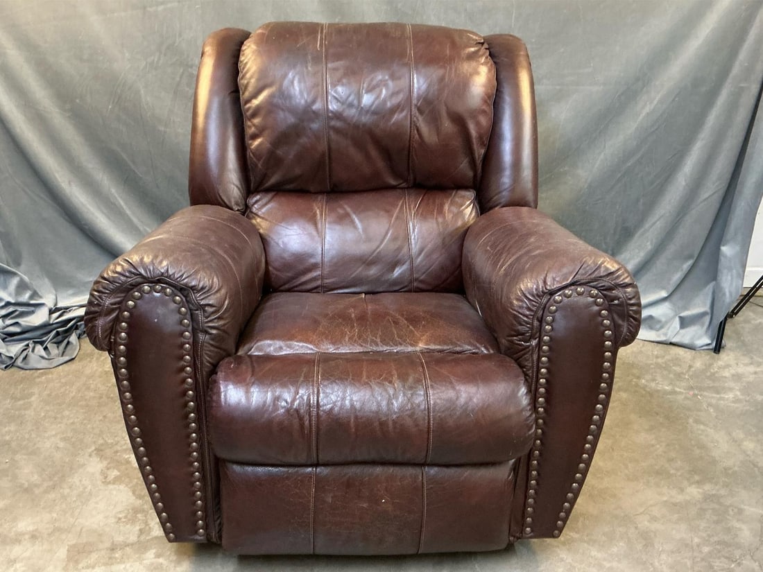 Faux Leather Reclining Armchair: Late 20th century faux leather reclining brown armchair. Some distress to fabric, needs cleaning, otherwise good condition. Measures 41 inches wide x 40 x 39.5 inches tall.