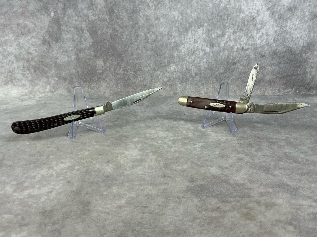 Case Pocket Knives: Two circa 1970's Case XX knives. One Case Slimline Trapper 61048 SS with six dots, stainless steel blade, brass liners, nickel silver bolsters, and bone handle. Made in 1974. Sharpened with nick to bl